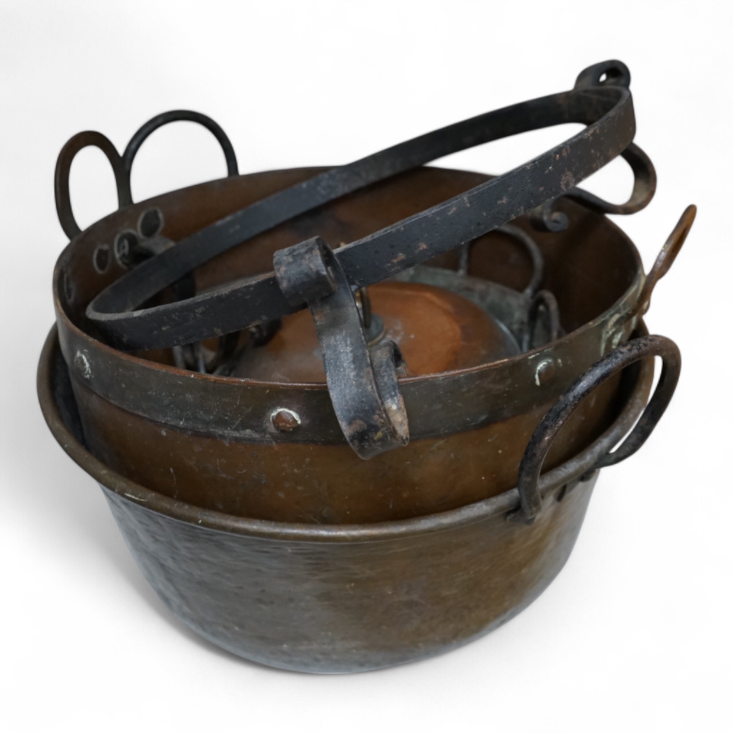 Four copper pans and a copper warming vessel